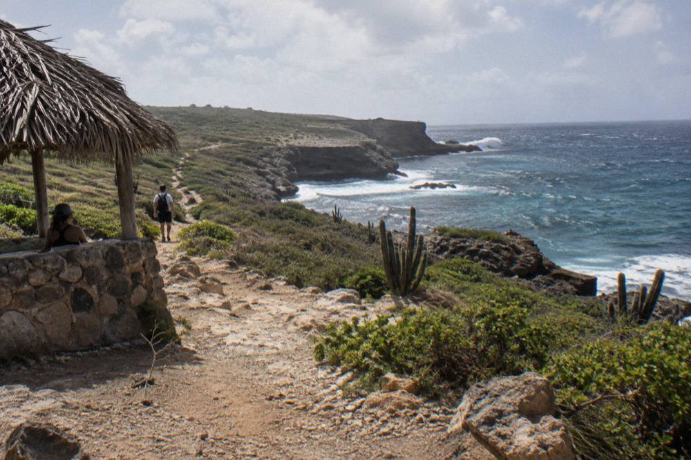 Rocky dirt track winding along Aruba's north coast toward coastal cliffs