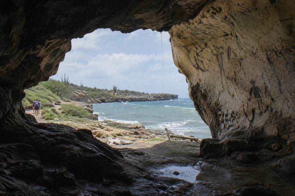 Limestone cave interior with daylight entering through an opening